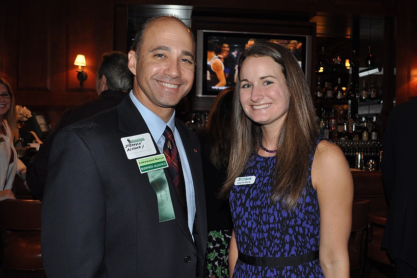Stephen Ackoury, of American Momentum Bank, with Lauren Boyle, of C1 Bank