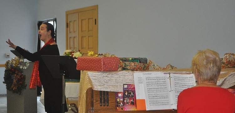 Soprano Michelle Giglio performed for the group, accompanied by Lee Dougherty Ross.