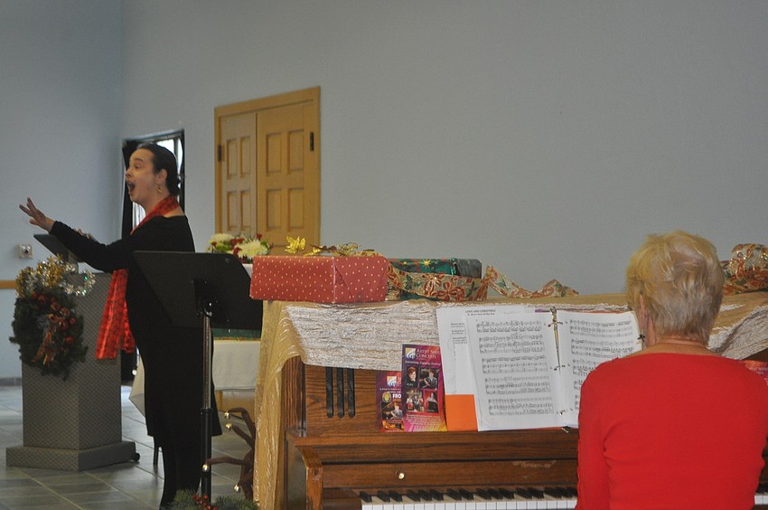 Soprano Michelle Giglio performed for the group, accompanied by Lee Dougherty Ross.