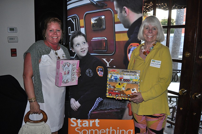 Samantha Hobbs and Dulcy Kushmore pose with their toy donations.