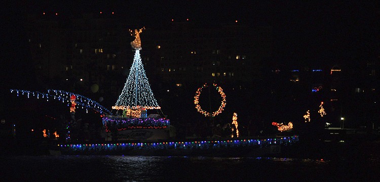 A Christmas tree with an angel on top, a wreath, Santaâ€™s sleigh and reindeer all made of lights made this boat shine on the water Saturday, Dec. 8, during the 26th Annual Sarasota Christmas Boat Parade.