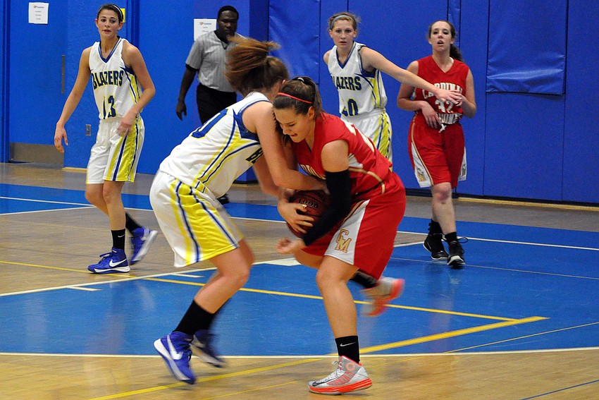 Sarasota Christianâ€™s Heidi Miller, No. 30, and Cardinal Mooneyâ€™s Bridget Walsh, No. 20, fight over possession of the ball.