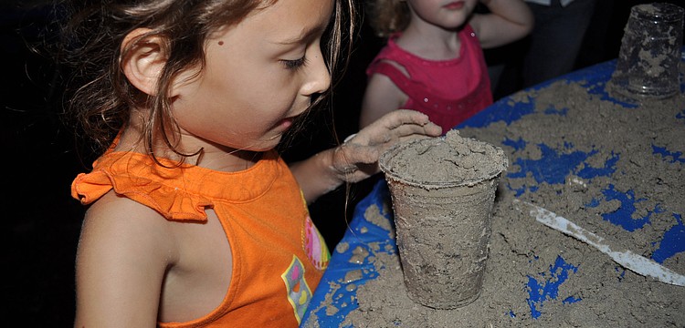 Lily Schlosberg, 5, learned how to make a menorah out of sand.
