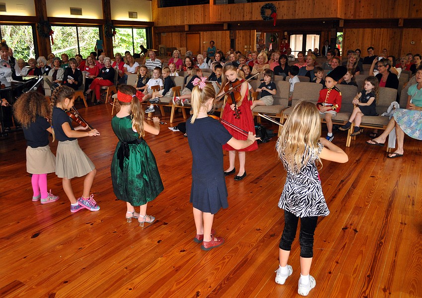 The Suzuki Violin Players perform Tuesday, Dec. 11, during the Christmas and Holiday Music Fest at Siesta Key Chapel.