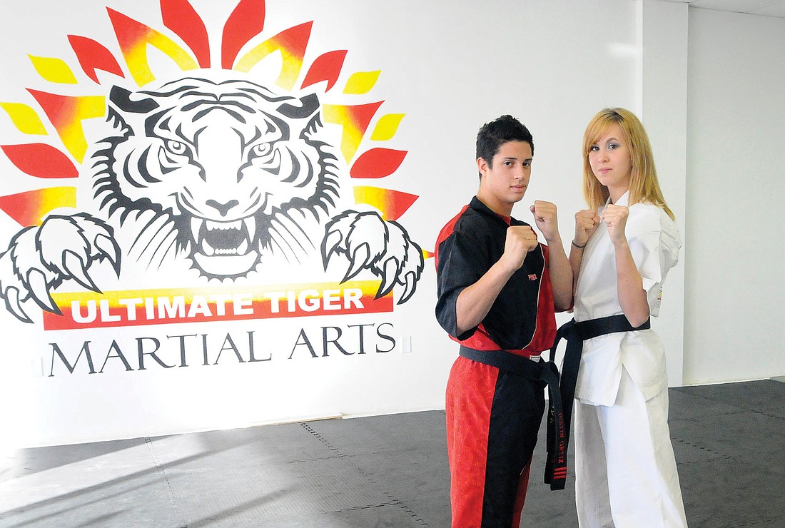 East County resident Robyn LeBuffe, right, pictured with her business partner, Justin Ortiz, opened Ultimate Tiger Martial Arts two years ago when she was 16 years old.