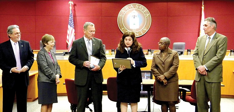 Sarasota County Commissioners Joe Barbetta, Nora Patterson, Christine Robinson, Carolyn Mason and Jon Thaxton surprised Interim County Administrator Terry Lewis [third from left] with special recognition for his service on Jan. 11.