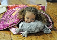 Kirin Singer snuggles up for story time at Out-of-Door Academy Jan. 27. ODA teachers led interactive songs and skits to promote the importance of reading.