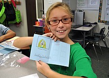 Audra Mullins shows off her passport.