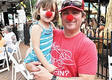 Todd Tedder and his daughter, Sophia, wore clown noses to the downtown block party that was held at Mattison's City Grille to watch local circus performer Nik Wallenda's daring tightrope walk over Niagara Falls.