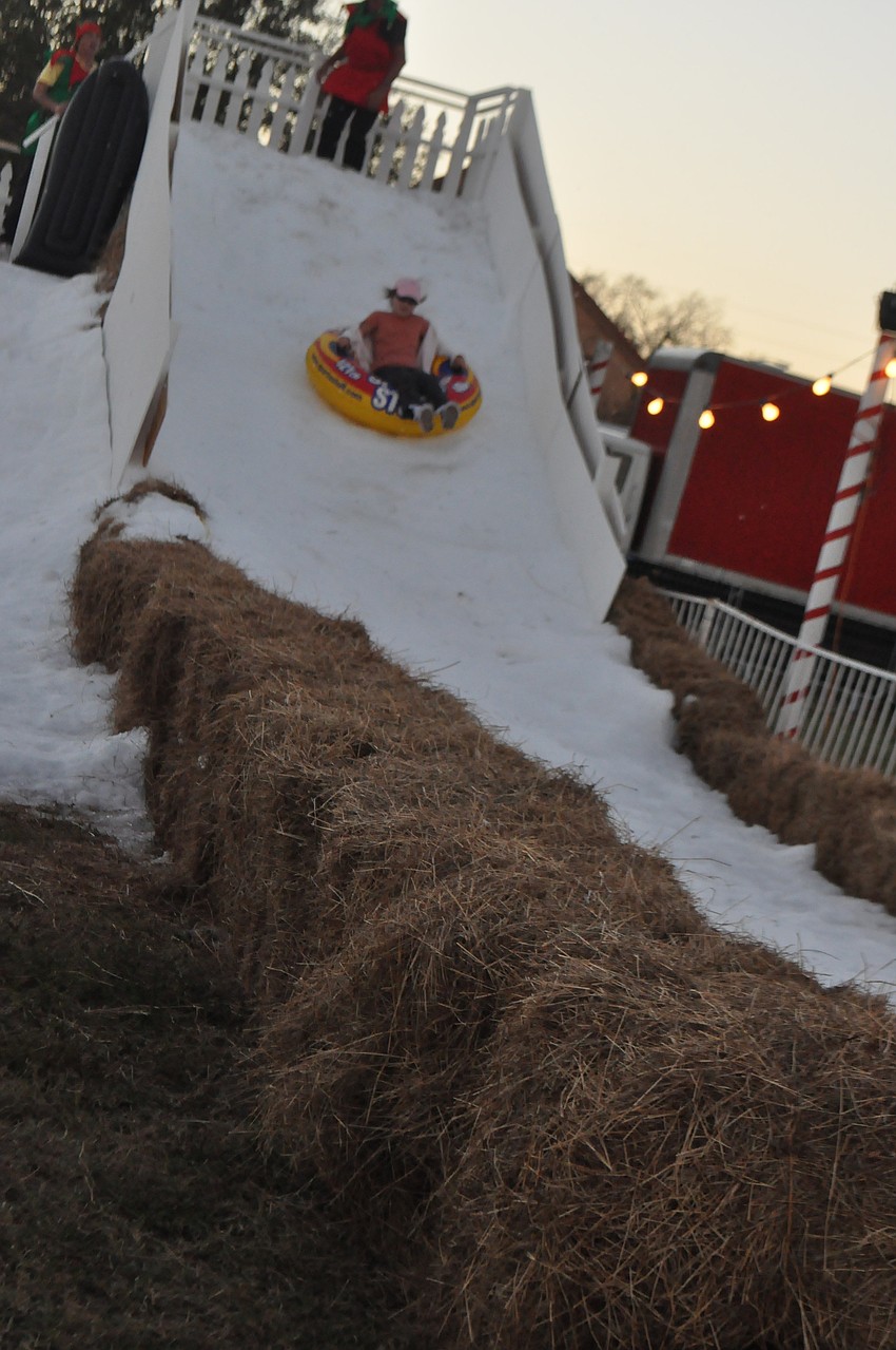 Johanna Post, 9, slides down a snow slide.