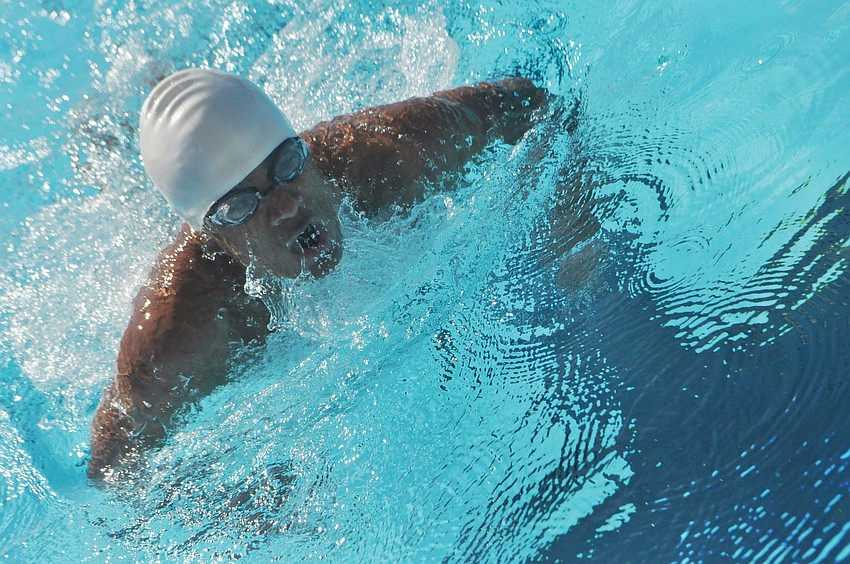 John Krueger competes in the 100 breaststroke in the FHSAA Class 1A Region 3 Swimming and Diving Championships at the Selby Aquatic Center.