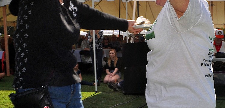 Jo Ann Mixon and Sandy Henley celebrated after winning $20,000 in a raffle during the Nov. 17 Gourmet Lawn Party at the Longboat Key Club and Resort.