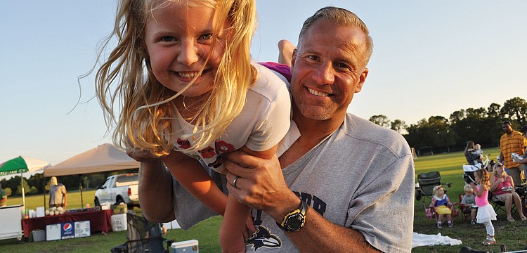 Joanna Graczyk got an airplane ride from her dad, Frank, before the show during Lakewood Ranchâ€™s Moonlight Movie April 27. Published May 10, 2012.