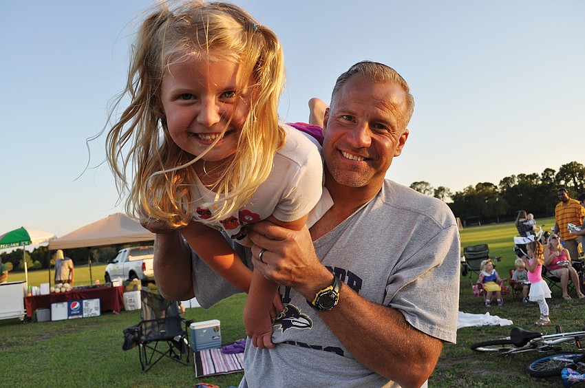 Joanna Graczyk got an airplane ride from her dad, Frank, before the show during Lakewood Ranchâ€™s Moonlight Movie April 27. Published May 10, 2012.
