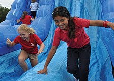 Braden River Elementaryâ€™s Lusero Acosta, front, and Lizzy Ebury, went on the slide as many times as they could, during the school's "Movin' and Groovin" Inflatables Day June 5. Published June 14, 2012.