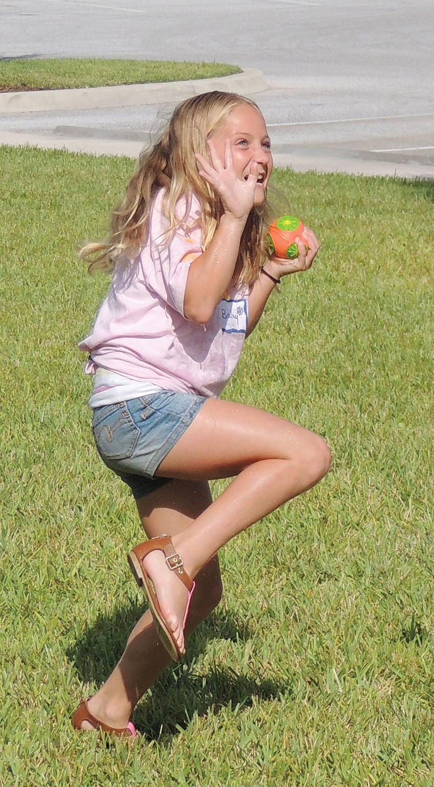 Bailey Scott readied to â€œcatch Godâ€™s lightâ€ from a friend., during Peace Presbyterian Church's 