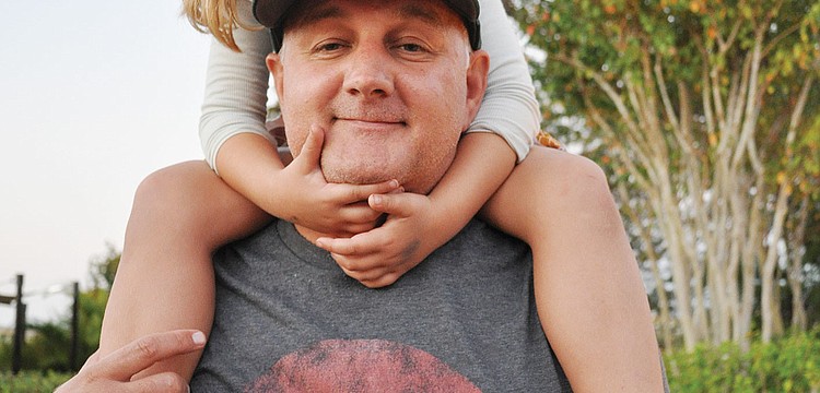 Sadie Fletcher, of Lakewood Ranch, gets a good view from the shoulders of her dad, Don, during Light the Night Nov. 3. Published Nov. 8, 2012.