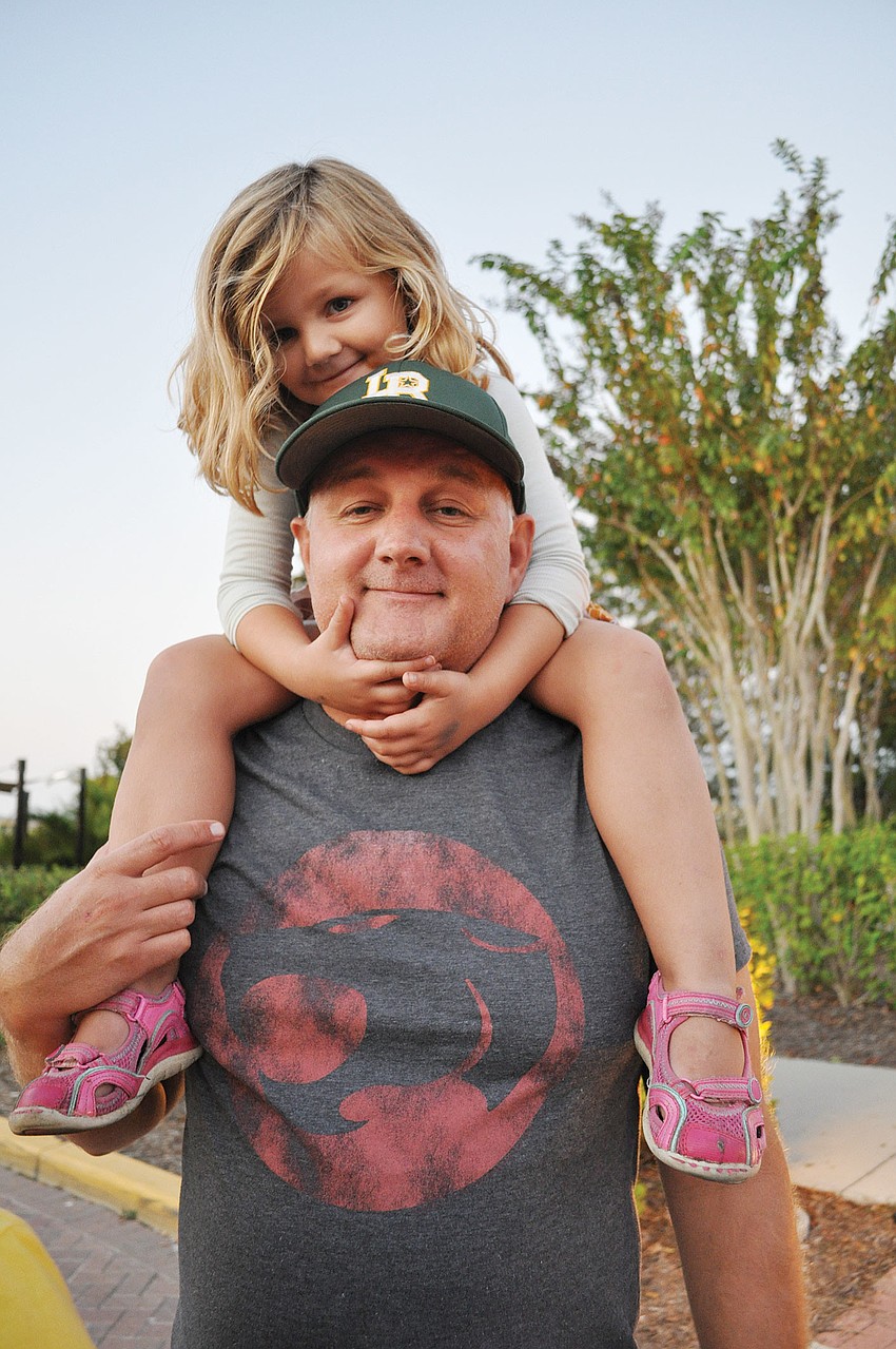 Sadie Fletcher, of Lakewood Ranch, gets a good view from the shoulders of her dad, Don, during Light the Night Nov. 3. Published Nov. 8, 2012.