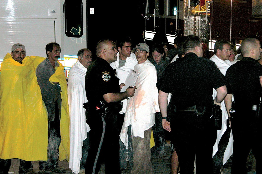 Longboat Key police and firefighters responded to assist 25 Cuban refugees early Dec. 21, 2006. File photo.