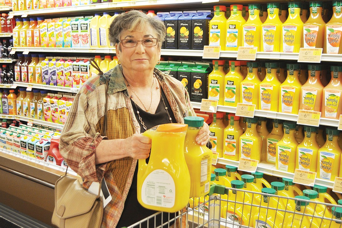 Joan Sinder, the first customer to walk through the doors of the new Publix, put bread in her cart before stocking up on orange juice.