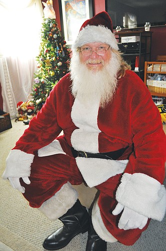 "I love candy canes," says Steve Hensell, who relishes his time as Santa. "I pass them out to every kid I see."