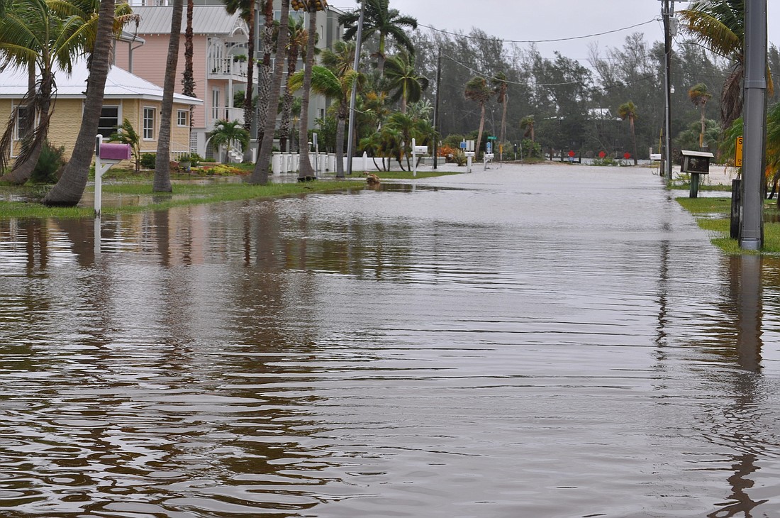 The Longbeach Village neighborhood saw flooding in the streets beginning Sunday. Photos by Mallory Gnaegy.