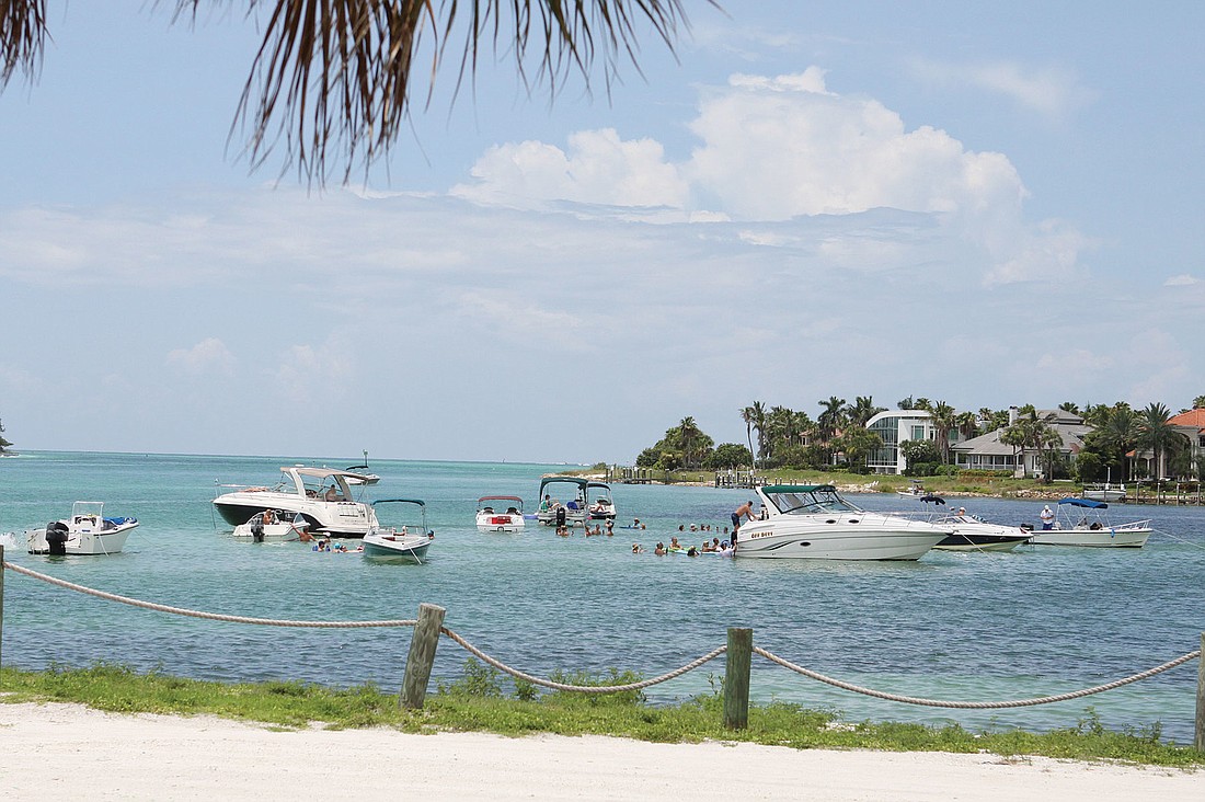 New Pass and Longboat Pass are bustling with boaters and beachgoers anxious to anchor their vessel and enjoy the sun off the shores of Longboat Key. File photo.