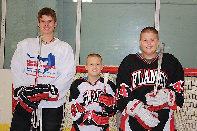 Brett Wessel, 16, and his younger brothers, Luke, 9, and Cade, 12, all began playing ice hockey for the Gulf Coast Flames travel organization during the past two years.