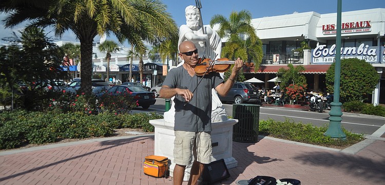 Violinist Anton Cutajar, who performs at weddings and parties and gives private lessons, treated shoppers at St. Armands Circle to his rendition of "What a Wonderful World" Tuesday, Jan. 8.