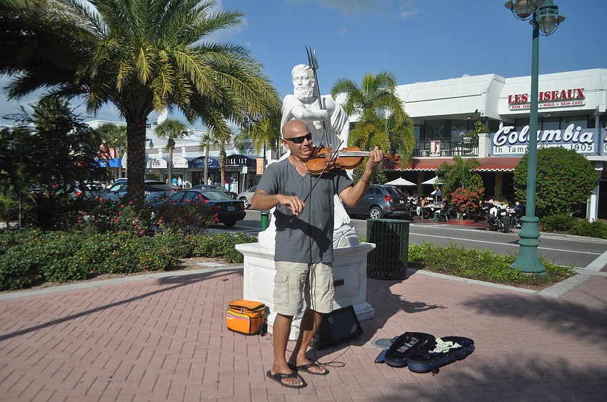 Violinist Anton Cutajar, who performs at weddings and parties and gives private lessons, treated shoppers at St. Armands Circle to his rendition of 