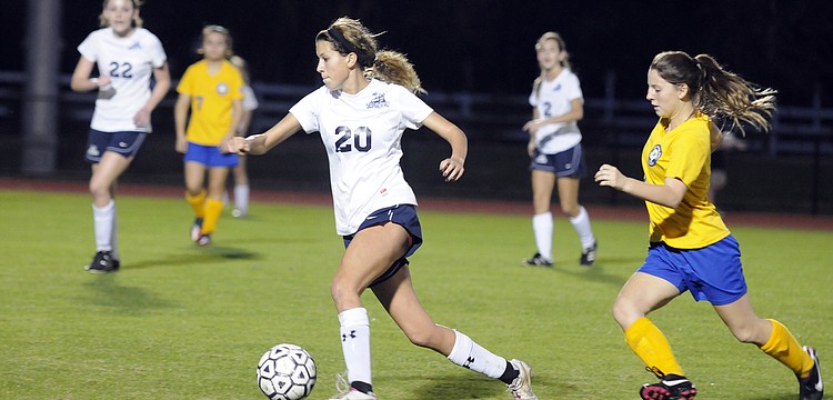 The Out-of-Door Academy senior Juliet Onufrak brings the ball up the field in the second half.