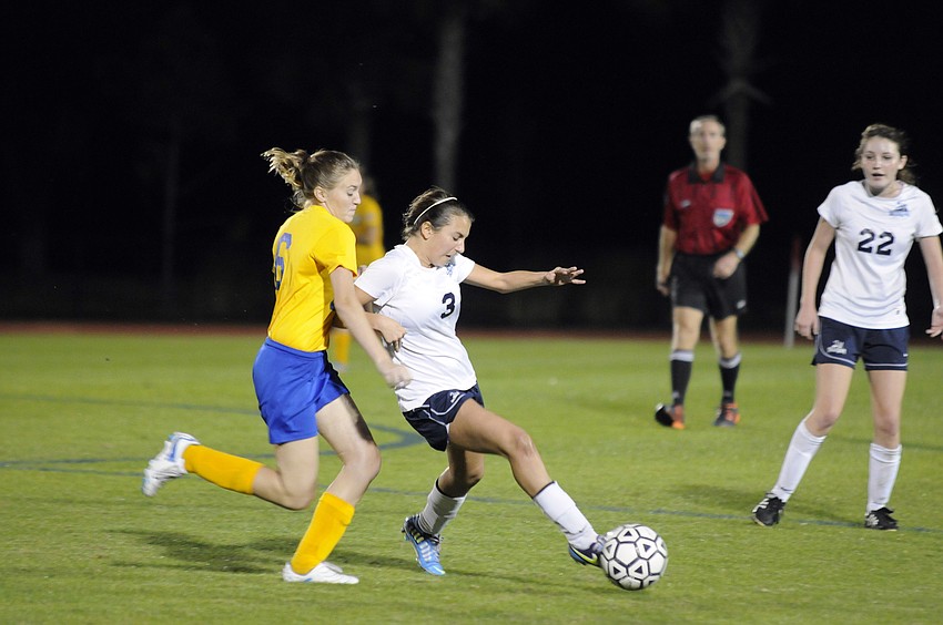 Sarasota Military Academy senior Abrianna Dague and The Out-of-Door Academy freshman Elena Ciaccio battle for possession.