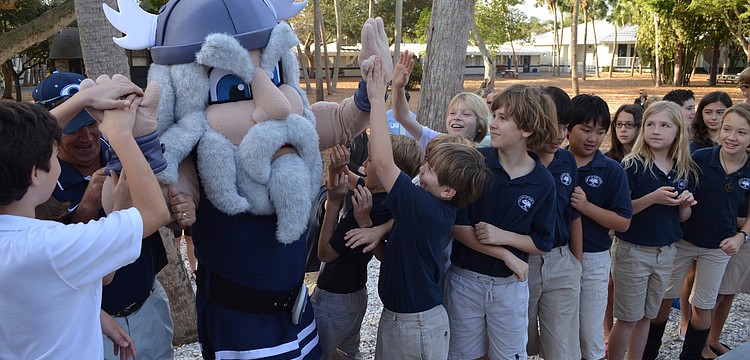 Kids get excited as mascot Thor makes his way to the ribbon cutting.