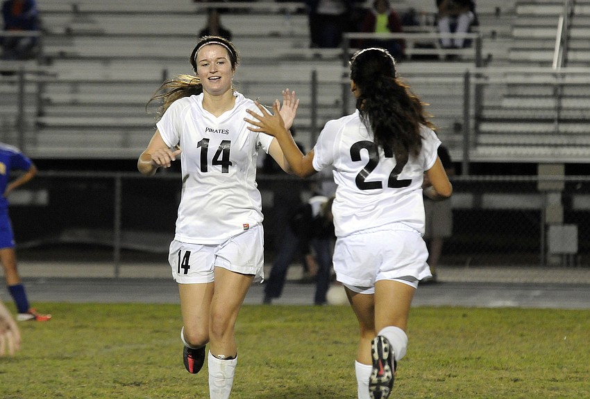 Braden Riverâ€™s Carly Provan is congratulated by one of her teammates after scoring her second goal in the final seconds of the match.