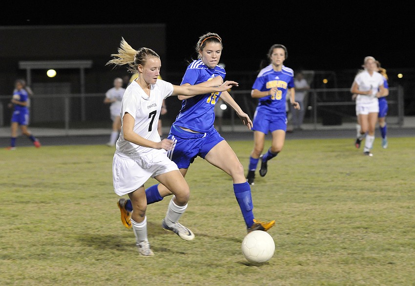 Braden Riverâ€™s Kyrstin Baily fights a Charlotte defender for possession.