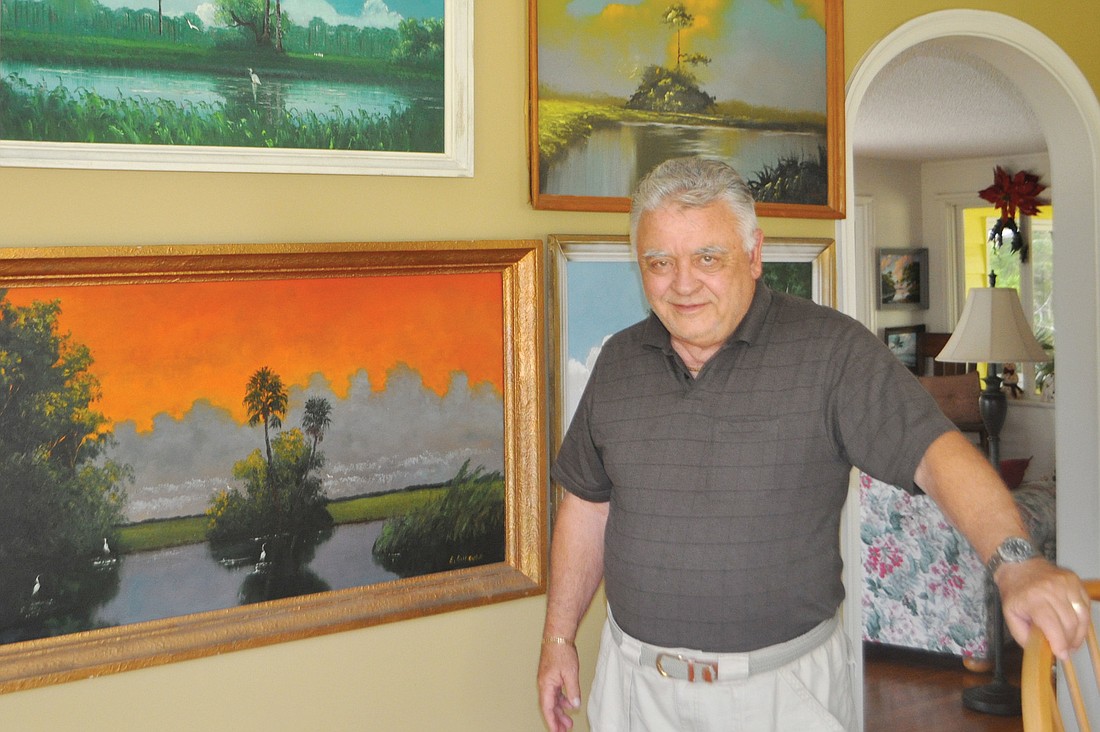 Siesta Key resident Lawrence "Larry" Helmuth's collection consists of 50 Highwaymen paintings. Photos by Robin Hartill.