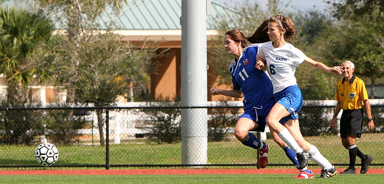 Northside Christianâ€™s Kayla Church, No. 11, and Sarasota Christianâ€™s Danielle Buncik, No. 6, both run for the ball.