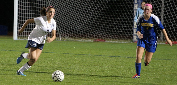 Out-of-Door Academyâ€™s Elena Ciaccio, No. 3, runs up the field with the ball as Canterburyâ€™s Lacy Scherer, No. 7, tries to cut her off.