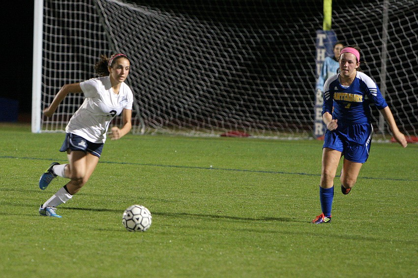 Out-of-Door Academyâ€™s Elena Ciaccio, No. 3, runs up the field with the ball as Canterburyâ€™s Lacy Scherer, No. 7, tries to cut her off.
