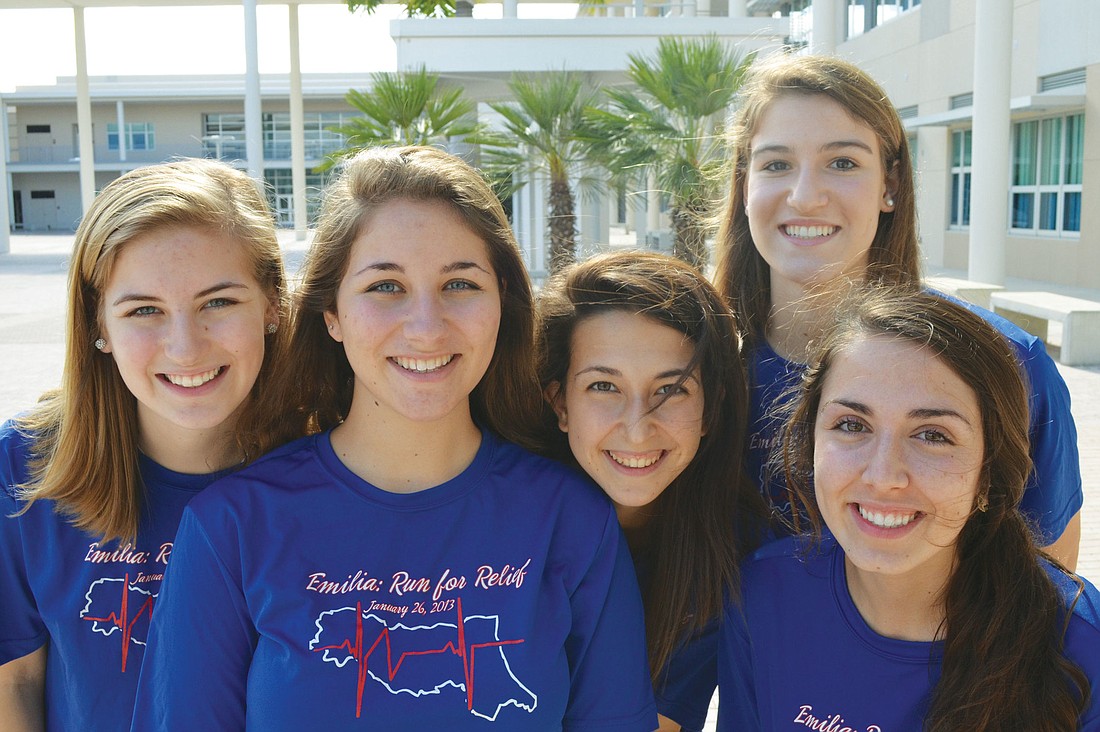IB students Alexis Boenker, Marielle Pezzella, Cristina Chiodi, Hannah Loss and Jaclyn Falconetti wear Emilia: Run for Relief T-shirts to support the cause. Photo by Yaryna Klimchak.