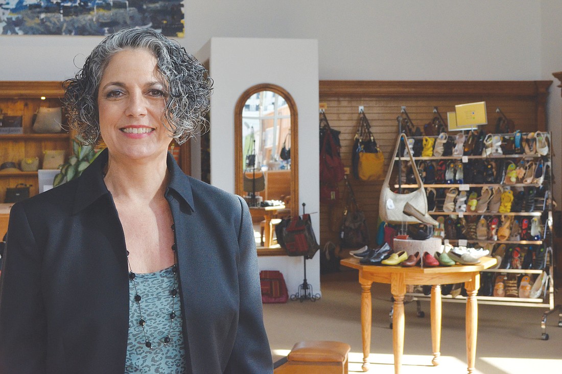 Leonore Morris, co-owner of Reasons Shoes, has seen a younger customer base since she and her husband moved the store to Main Street. Photo by Yaryna Klimchak.