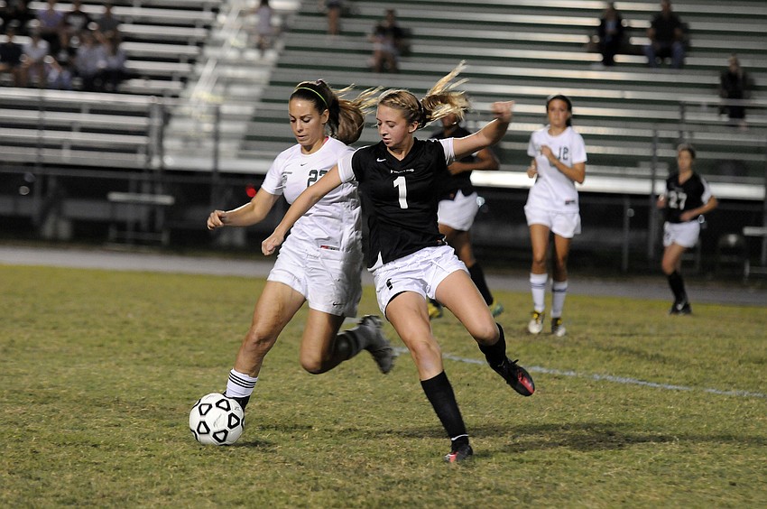 Lakewood Ranchâ€™s Maria Miller and Braden Riverâ€™s Kendall McNab battle for possession.