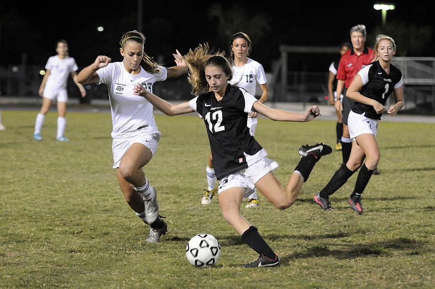 Braden Riverâ€™s Kennedy McCarthy tries to keep the ball in play and away from Lakewood Ranchâ€™s Maria Miller.