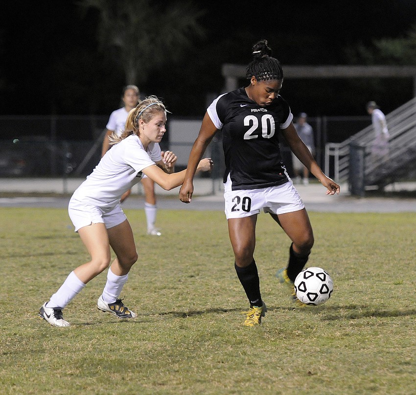 Lakewood Ranch defender Amanda Baar looks to keep Braden River forward Kayla Gray from moving the ball to the outside.