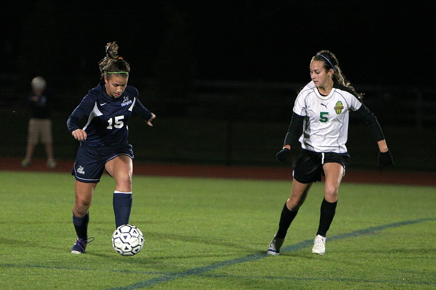 ODAâ€™s Miller Condrack, No. 15, runs the ball up the field while Shorecrest's Erika Tvedten, No. 5, tries to get ahead.