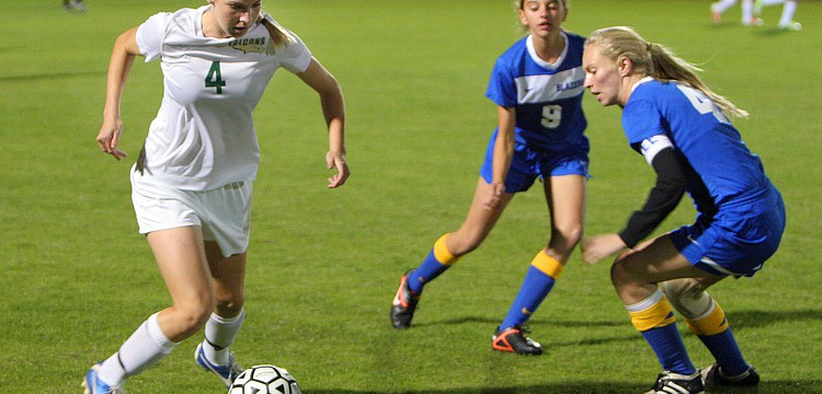 St. Stephenâ€™s Hannah Howell, No. 4, tries to keep the ball away Sarasota Christian.