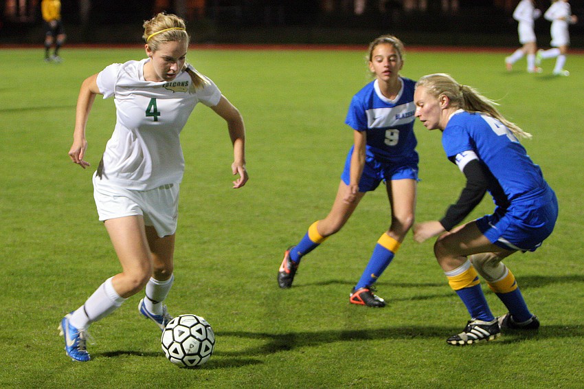 St. Stephenâ€™s Hannah Howell, No. 4, tries to keep the ball away Sarasota Christian.
