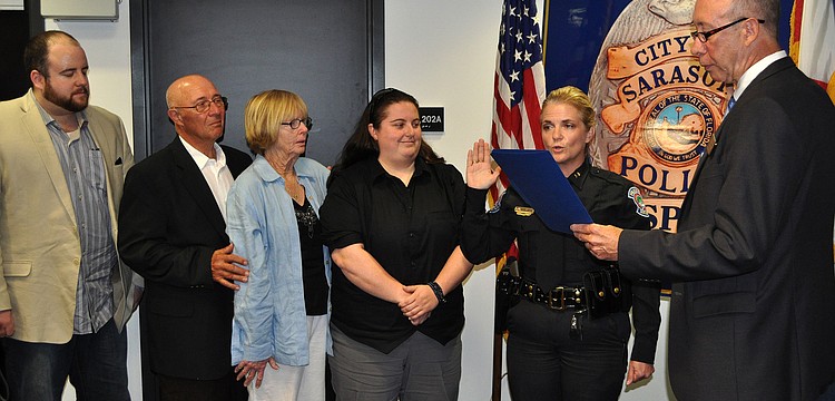 City Manager Tom Barwin swears in Bernadette DiPino as Sarasota's police chief Friday, Jan. 18, at the Police Department.