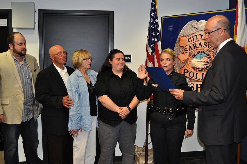City Manager Tom Barwin swears in Bernadette DiPino as Sarasota's police chief Friday, Jan. 18, at the Police Department.