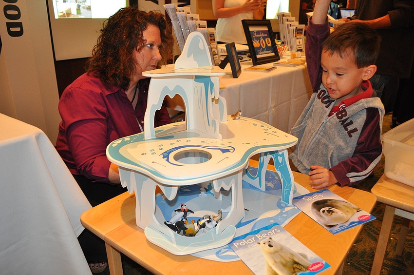 Sindy Jones of Foundations Academies in Sarasota watched Alex Johnson play with the Interactive Polar Playland.